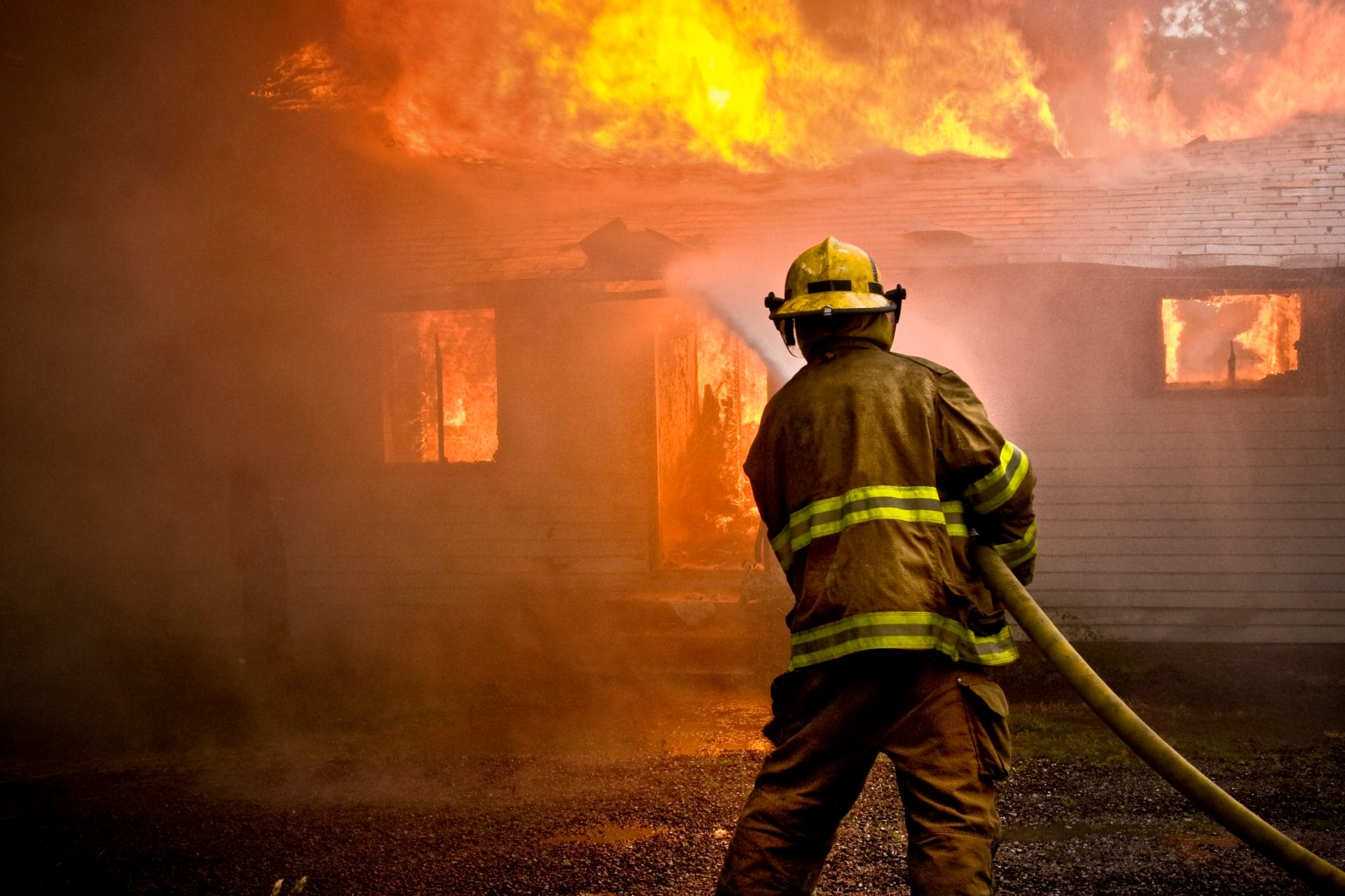 Firefighter putting out fire
