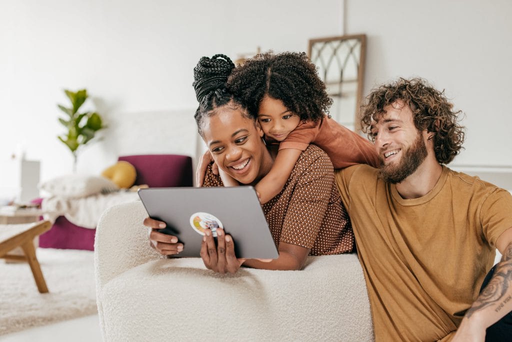 Family looking at their tablet