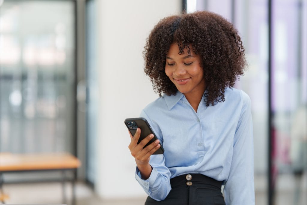 Woman checking her Guardian Protection app