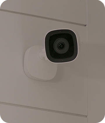 Indoor home security camera installed on home's wall
