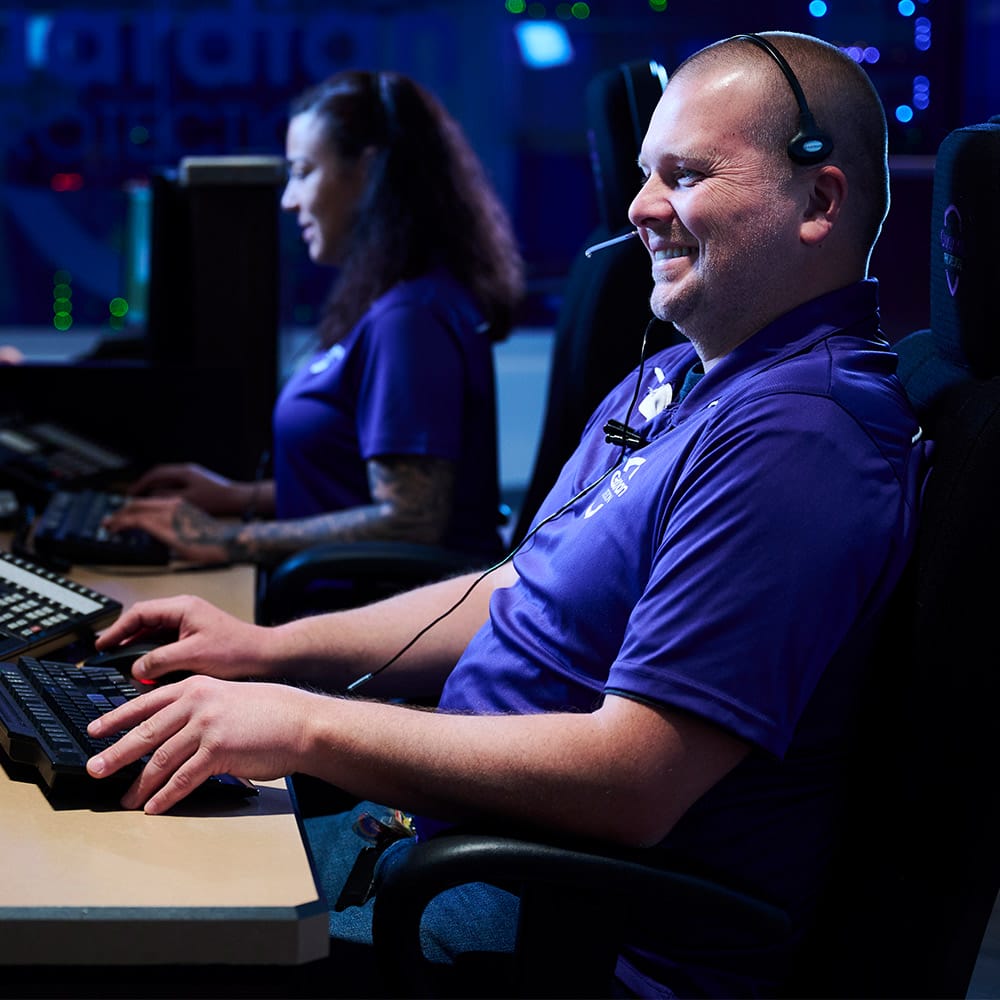 Two Guardian Protection Specialists working in the Monitoring Center