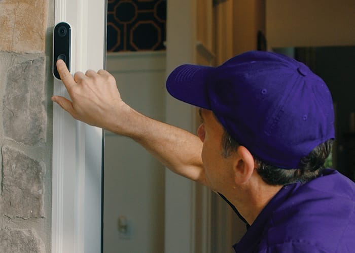Guardian Protection technician installing a video doorbell