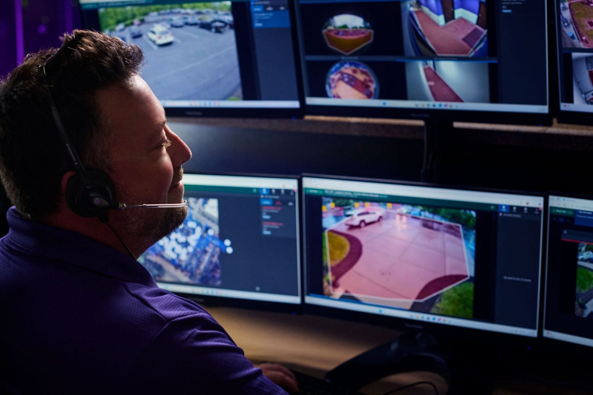 Guardian Protection security expert looking at screens showing proactive video surveillance feeds